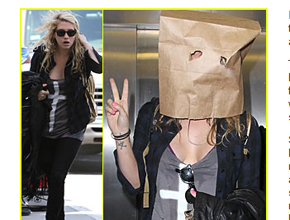 Saco de papel: Ke$ha chega mascarada a aeroporto