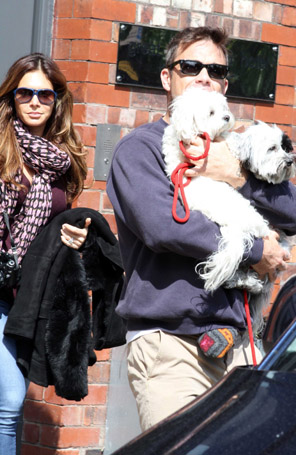 Robbie Williams leva <i>pet</i>s no colo