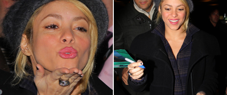 Com esmalte descascado, Shakira assina autógrafos para fãs
