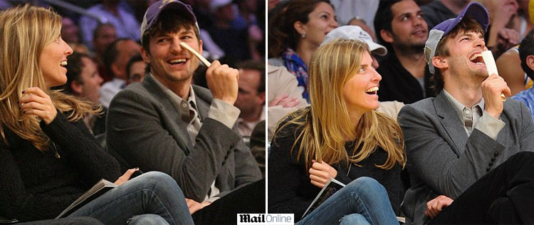 Ashton Kutcher curte jogo acompanhado de mulher misteriosa