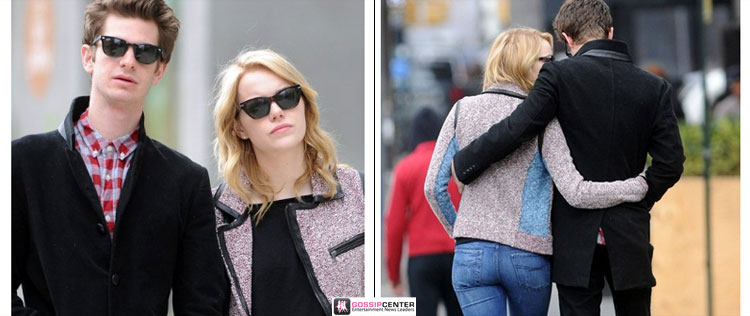 Andrew Garfield e Emma Stone passeiam abraçados