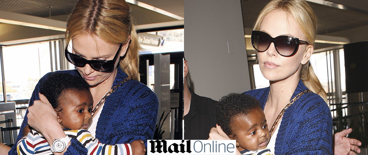 Charlize Theron é fotografada com o filho em aeroporto