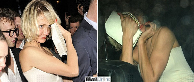 Cameron Diaz tenta esconder o rosto ao deixar balada