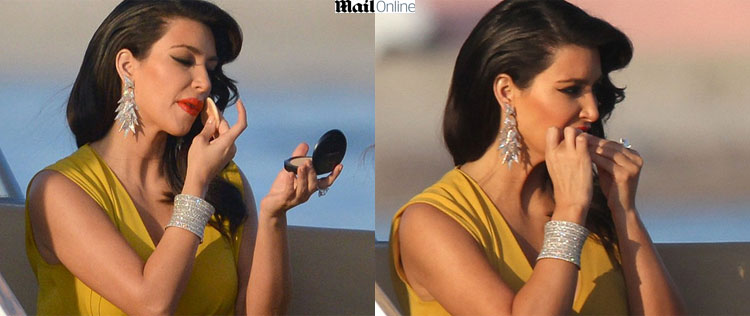 Kim Kardashian aparece roendo as unhas, antes de evento da amfAR