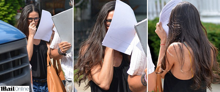 Demi Moore tenta se esconder dos <I>flashes</i> em <I>set</i>