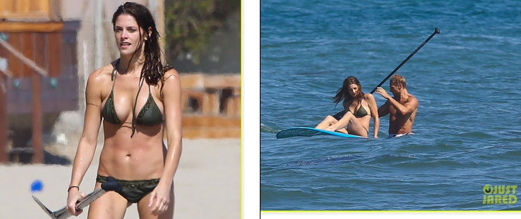 Ashley Greene mostra corpão na praia com homem não identificado