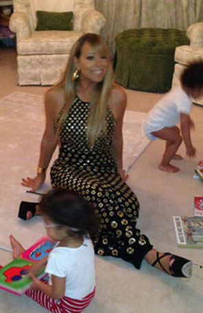 Mariah Carey, usando um vestido chique, coloca seus filhos para dormir, veja a foto!