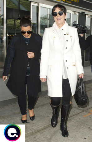 Kim Kardashian tenta esconder barriga ao deixar aeroporto