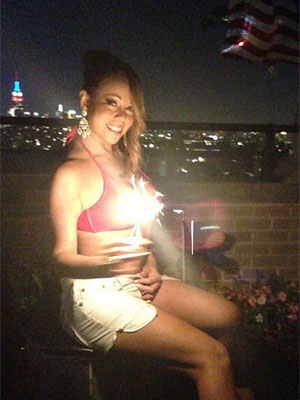 Com <i>shorts</i> curtos e <i>top</i>, Mariah Carey celebra feriado norte-americano