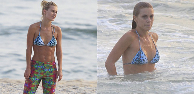 Carolina Dieckmann faz treino na praia e exibe abdômen trincado
