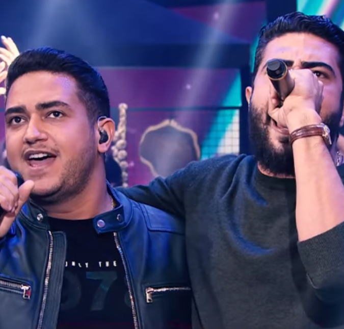 Henrique e Juliano tentam contornar, mas plateia canta música com palavrão durante o <I>Faustão na Band</i>