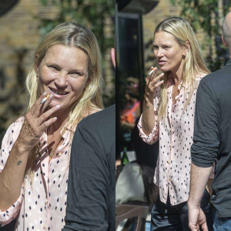 Sem maquiagem, Kate Moss é clicada fumando na frente de