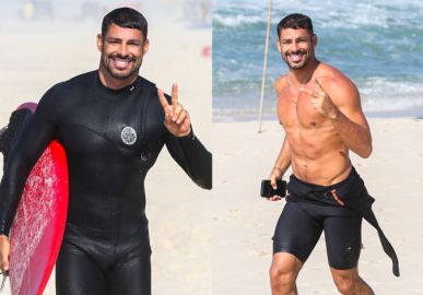 Cauã Reymond exibe corpão ao surfar na praia da Barra da Tijuca