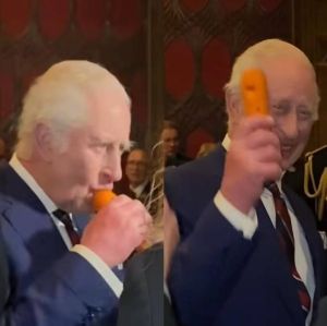 Em momento inusitado, Rei Charles III toca instrumento feito de cenoura